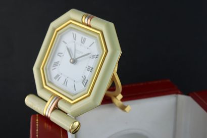 null CARTIER ref. 7517
Table clock with octagonal case, pedestal and trinity rings...