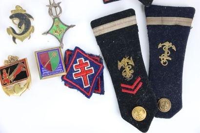 null In a wooden box. More than fifty regimental badges and some decorations, including...