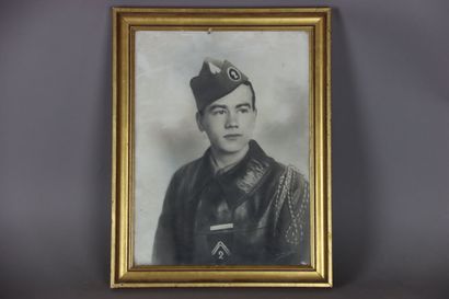 null - Studio photograph of a rider wearing a leather jacket and a police cap with...