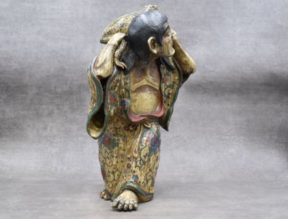 asie. Ceramic subject representing a man carrying a frog. Height : 42 cm