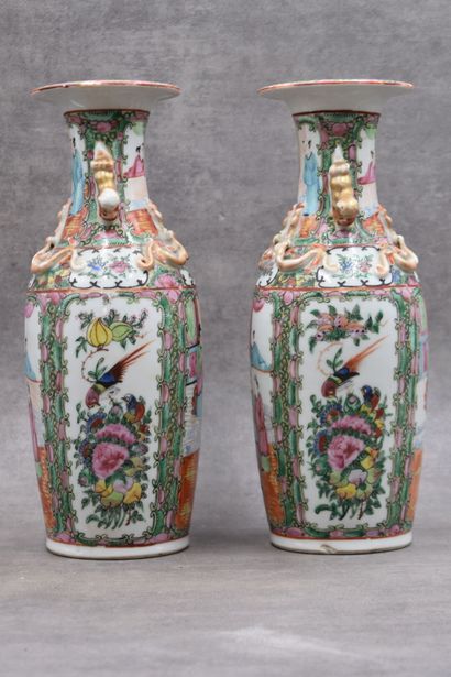 CHINE-Canton. Pair of porcelain vases decorated with scenes of characters and foliage,...