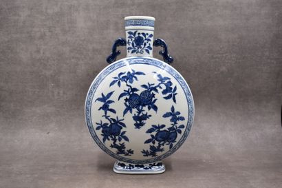 CHINE XX siècle. Vase of flattened gourd form, out of blue-white porcelain, with...