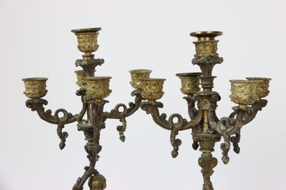null Pair of gilt bronze candlesticks with five lights. Decorated with putti and...