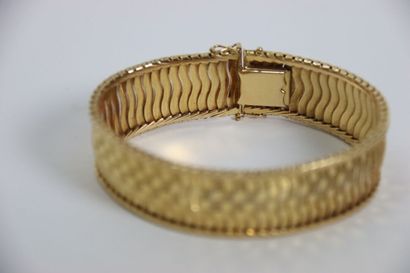 Bracelet Bracelet souple en or jaune 18K (750/1000) 

Fermoir à cliquer et double...