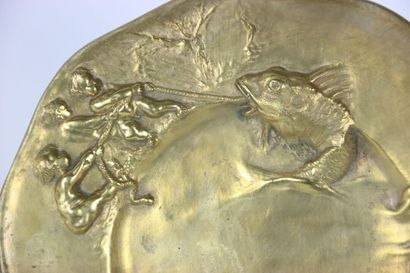 null Gilt bronze dish decorated in relief with Putti fishing a big fish, signed on...