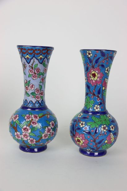 null Pair of enameled porcelain vases with floral decoration on a blue background,...