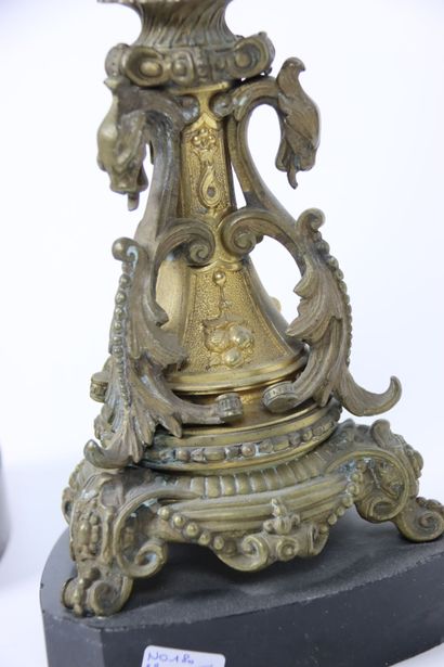 null Pair of gilt bronze candlesticks with five lights. Decorated with putti and...