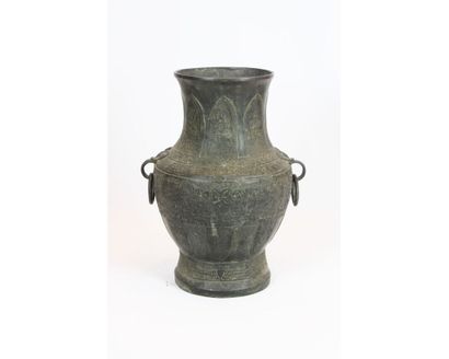 null CHINA. 19th century. Baluster vase in bronze, the body decorated with taotie...