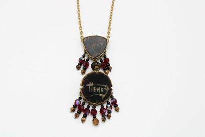 null Henry PERICHON (1910-1977)
Necklace in gilded metal centered of a triangular...