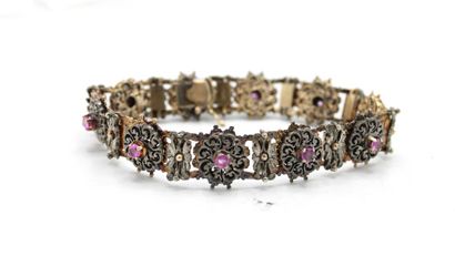 null Silver and gold bracelet 18K (750/1000) decorated with red stones with floral...