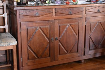 null Buffet two bodies in carved wood opening by six doors and four drawers, with...
