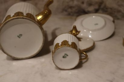 null White porcelain coffee set, decorated with gold leaves, coffee pot, sugar bowl...