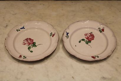 null CUSTINES. Pair of plates in enamelled earthenware, with polychrome floral decoration,...