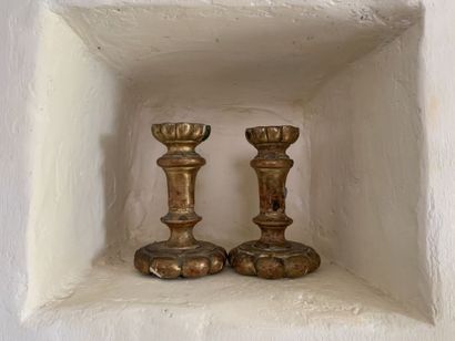 null Pair of molded and gilded wood end candlesticks, in the 18th century taste....