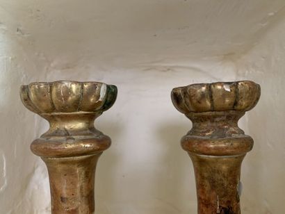 null Pair of molded and gilded wood end candlesticks, in the 18th century taste....