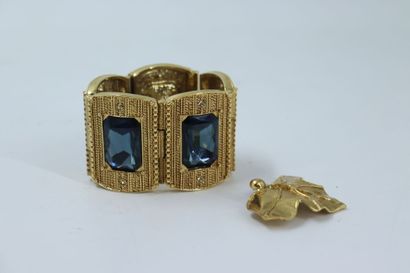 null SCHERRER. Meeting of a cuff and a fancy clip, gold metal and colored stones....