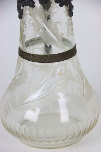 null Large crystal decanter with decoration of foliage, mount and handle out of worked...