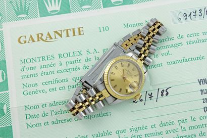null ROLEX Date lady réf. 69173
Montre bracelet de dame or et acier. Boitier oyster...