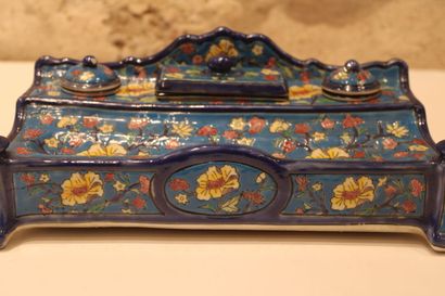 null Large enamelled ceramic inkwell decorated with polychrome flowers on a blue...
