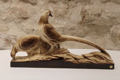 null Couple of pheasants in polychrome ceramic on a base. Length : 62,5cm Height...