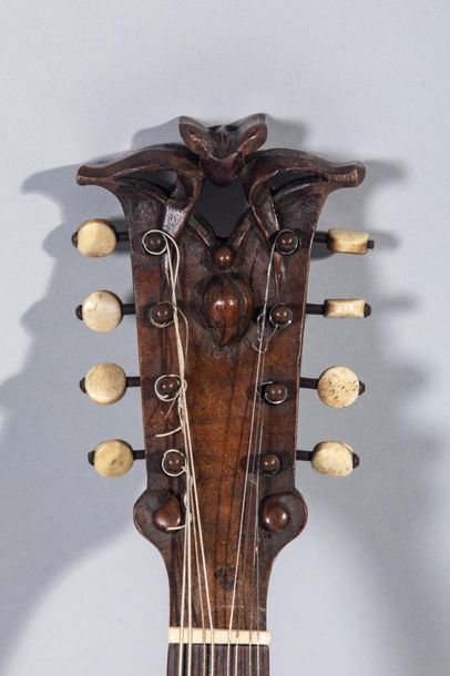 null Amazing mandolin with walnut back, holes on the sides, beautiful sculpted head...