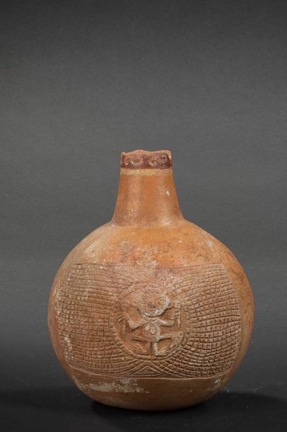 null Gourd vase decorated with a zoomorphic anthropo character in relief in a medallion....
