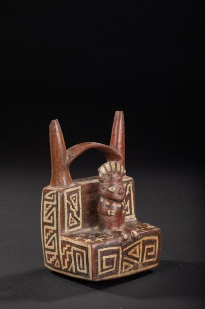 null Vase with double neck representing a figure sitting in the middle of a temple

Polychrome...