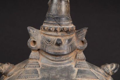 null Vase on a pedestal representing a mythical scene with the face of the deity...