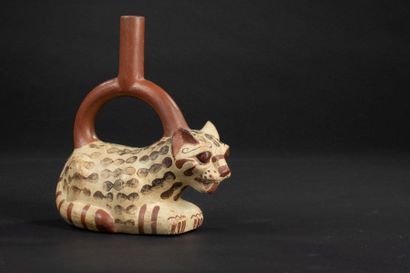 null Bow handle vase with a stirrup-shaped handle representing a Jaguar. Lying on...