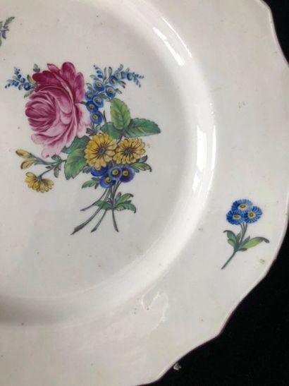 null TOURNAI Soft paste plate with contoured rim, polychrome decoration of a bouquet...