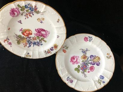 null PARIS. SAMSON. Two PORCELAIN plates of lobed shape with polychrome floral decoration...