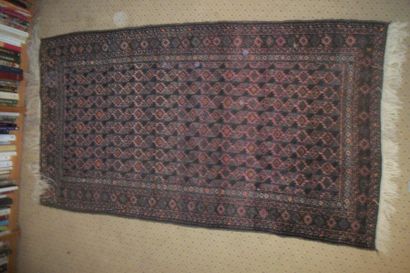 null Belushistan carpet, old pink background, brown and black decoration of leaf...