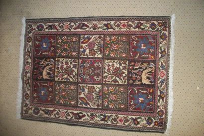 null Baktyar carpet called "garden", compartments with cream, green, red or black...