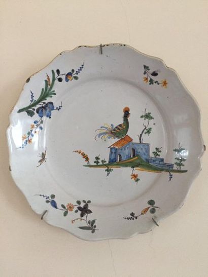 null Assiette en faïence à décor polychrome d'un coq - Nevers XVIIIème siècle 

(D'un...