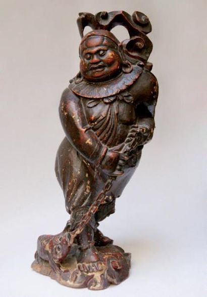 ASIE Fin XIXème - Début XXème "Bouddha avec animal fantastique à ses pieds". Sculpture...