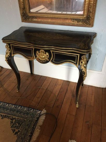 null Blackened wooden console forming a game board

Bronze ornamentation

Louis XV...