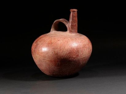 null Vase globulaire avec anse

Terre cuite à engobe rouge

Culture Chorrera, Equateur

800...