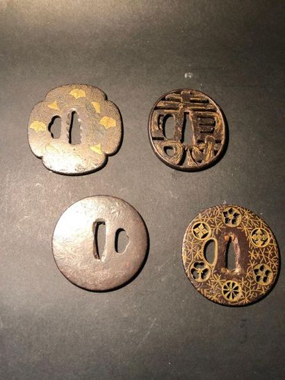 null Four round iron tsubas and one cross-shaped. (Signed)

Japan. Period MEIJI ...