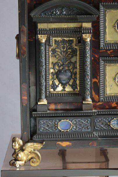 null Travel cabinet in blackened wood and scales

It opens on the front by a series...