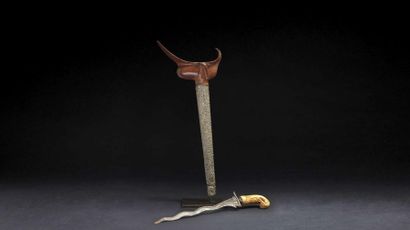 null Wrought iron knife "Kriss" with carved ivory handle, wooden hilt, and its metal...