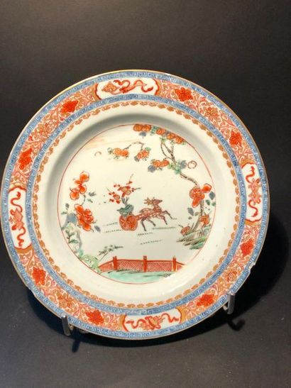 null Porcelain plate with "green family" decoration of a deer on a terrace pulling...