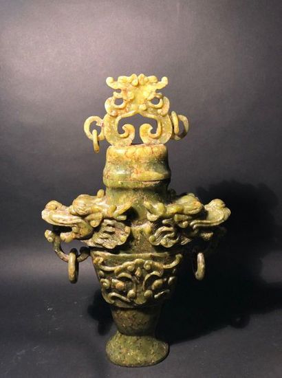 null Perfume burner carved with two dragon heads holding jadeite rings. China 20...