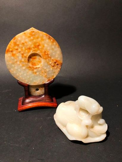 null A typical archaic rusty jade disc.

White jade group