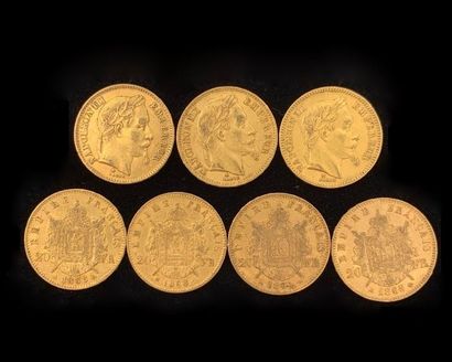 null 
Sept pièces 20FF Napoléon III tête laurée en or (900‰) datées 1964, 1965, 1968...