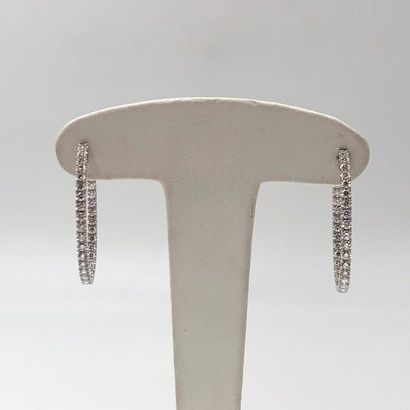 null Pair of "Creole" EARRINGS in white gold (750‰) set with an alignment of 62 brilliant-cut...