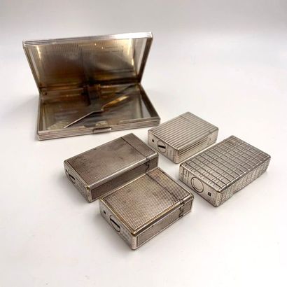 null S.T. DUPONT 

Four BRIQUETS in guilloché and gadrooned silver plated metal....