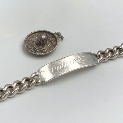 null Silver LOT (min. 800‰) including : - a BRACELET bracelet centered on a plate...