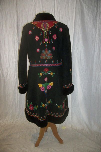 null Coat in turned over skin, Poland, black background, polychrome embroidered decoration...