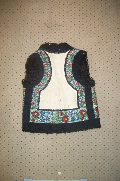 null Waistcoat, Romania, cream turned upside down skin, embroidered with glass beads...