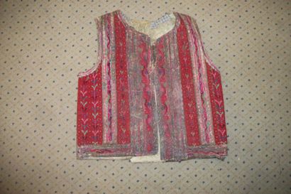 null Waistcoat in turned over skin, Romania, densely embroidered in red flowers,...